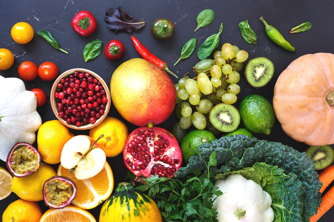 eat raColorful organic raw fruits and vegetables from the farmer's market, dieting and nutrition concept